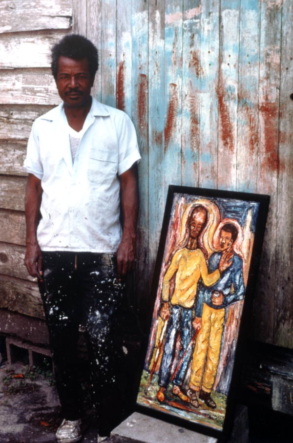 Pharaoh Baker with one of his paintings- Lake City, Florida