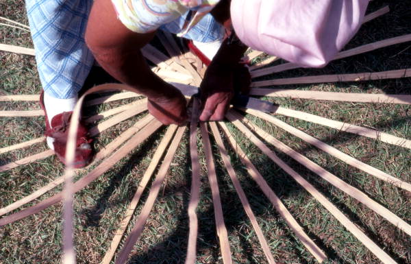 Lucreaty Clark starting to weave a white oak basket