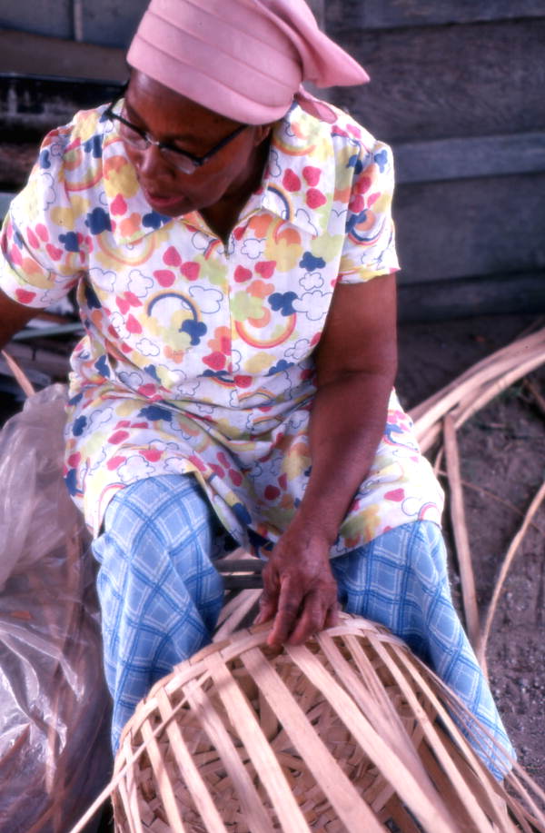 Lucreaty Clark weaving a white oak basket