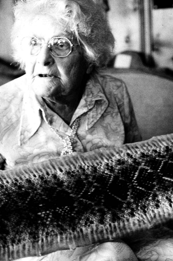 Maggie Melton holding up snakeskin- Plant City, Florida.