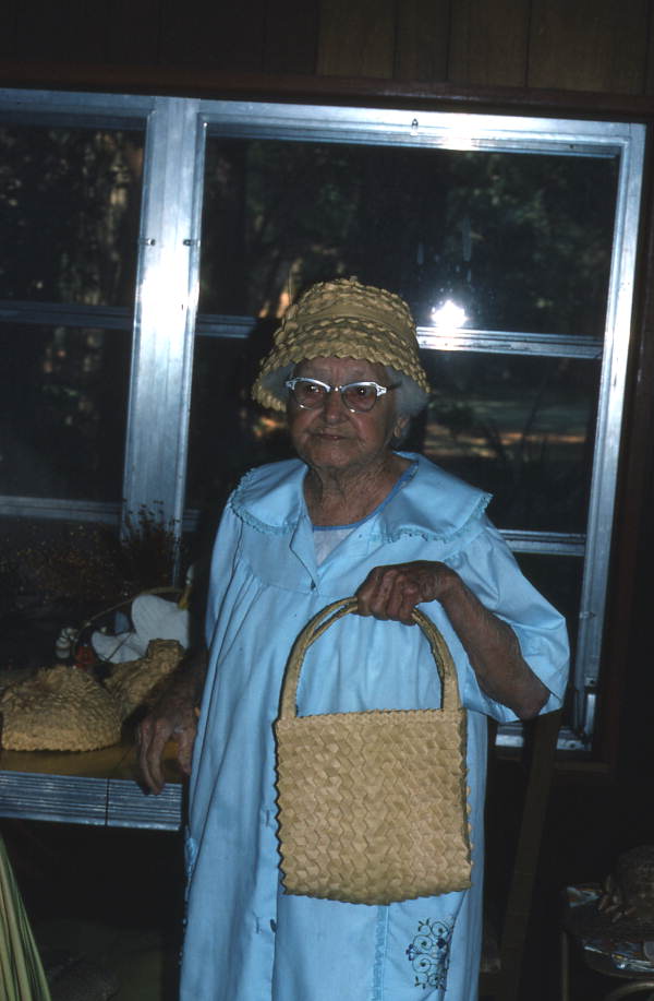 Pearlie Gates holding a handbag she made