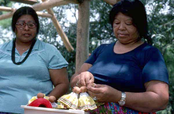 Mary Billie sewing clothes on the Seminole dolls she is making - Big Cypress Reservation, Florida