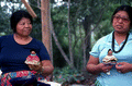 Mary Billie and her daughter Claudia C. John holding handmade Seminole dolls - Big Cypress Reservation, Florida