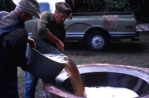 Pouring out sugar cane syrup - Orlando, Florida.