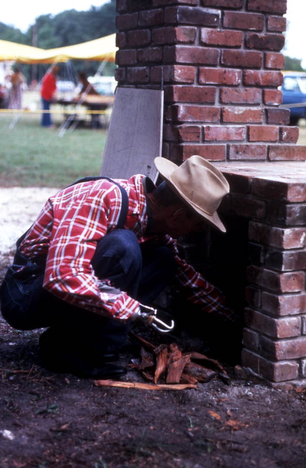 Placing firewood in the fireplace - Orlando, Florida.