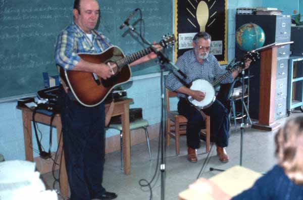 Bunch Bass playing guitar and Tom Herndon playing banjo for junior high class - Lake City, Florida.