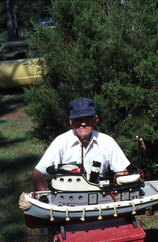 Mack Brown holding a model boat he made - Panama City, Florida.