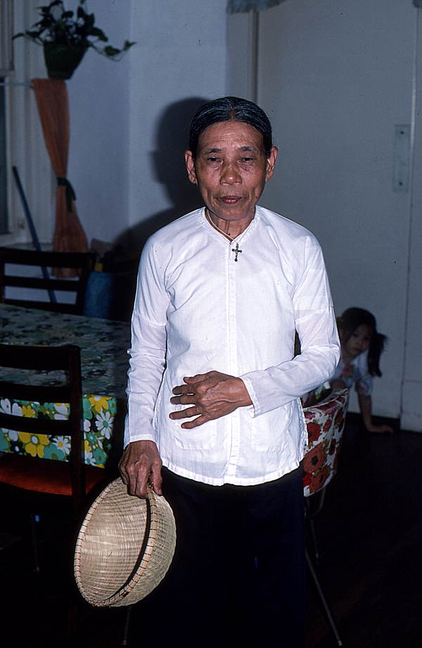 Vietnamese American basket maker Nhang Bui with one of her works- Pensacola, Florida.