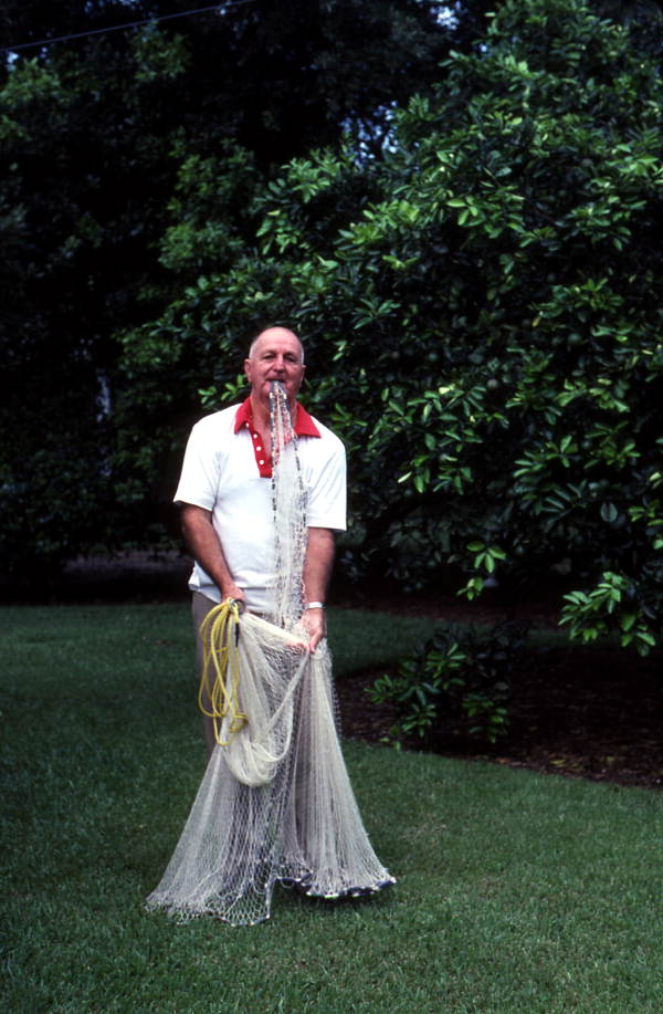 Lloyd Snow showing how to use a cast net - Daytona Beach, Florida