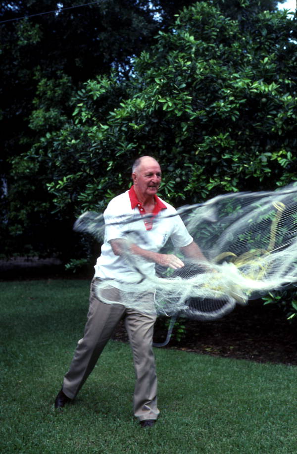 Lloyd Snow casting a fishing net - Daytona Beach, Florida