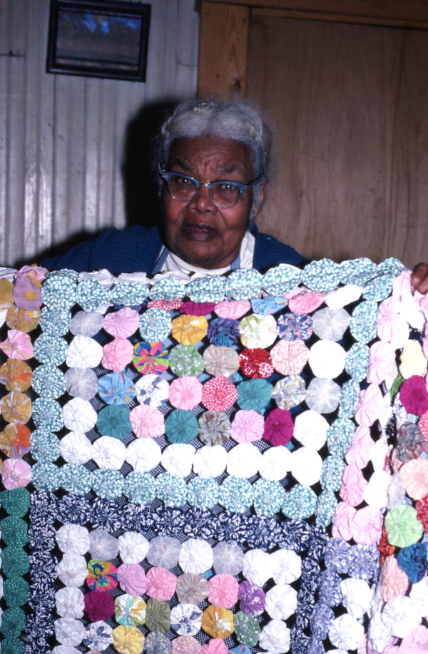 Ruth Rowe with a "yo-yo" coverlet she made - Pomona Park, Florida.