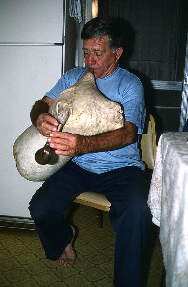 Nikitas Tsimouris playing a tsambouna for his family - Tarpon Springs, Florida