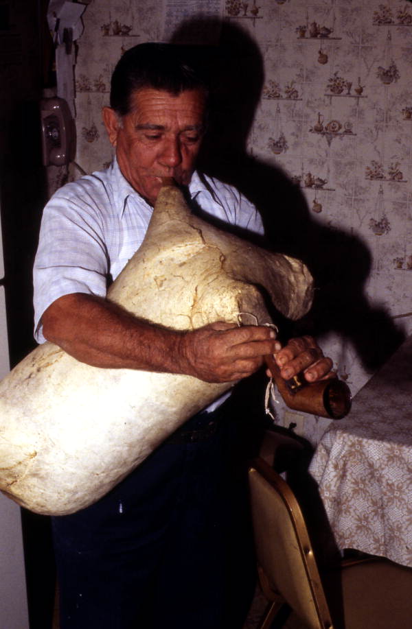 Nikitas Tsimouris playing a tsambouna - Tarpon Springs, Florida