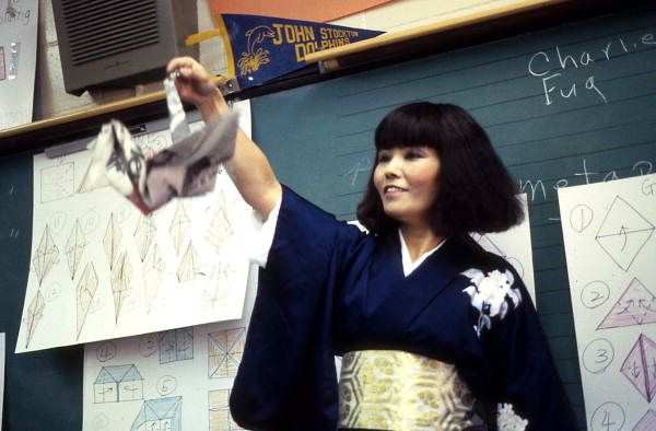 Yasuko Dawson making origami for students - Jacksonville, Florida.