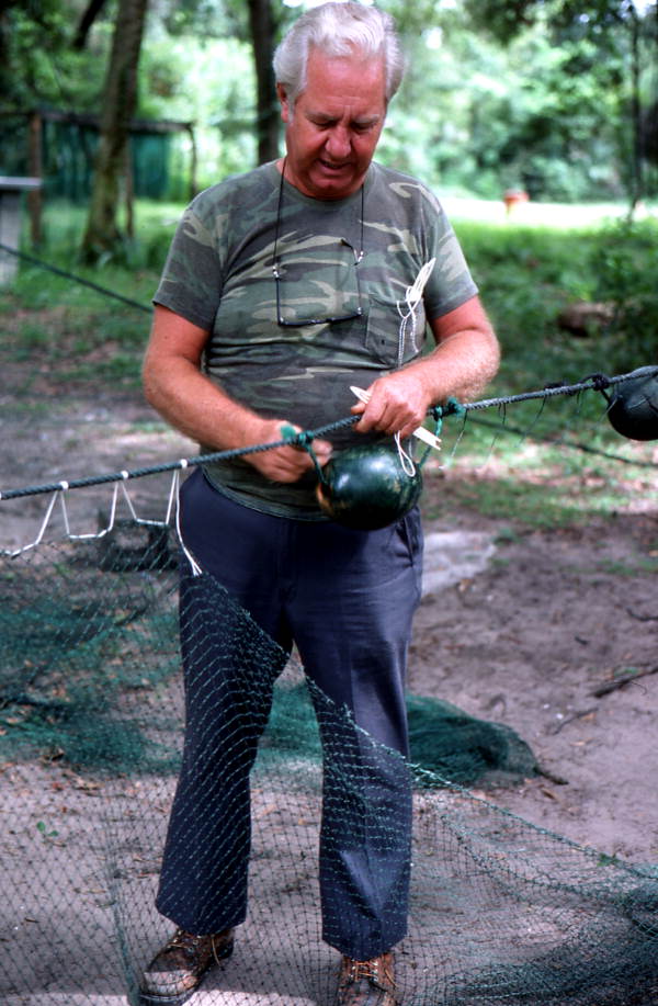 Net maker Martin Cooper repairing a shrimp trawl net - Jacksonville, Florida.