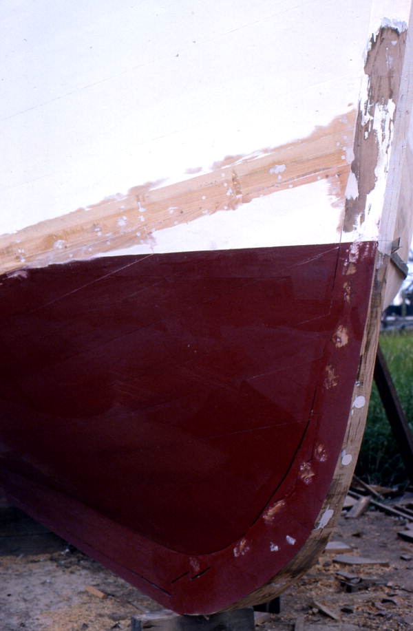 Caulked and painted bow stem of boat being built - Jacksonville, Florida.