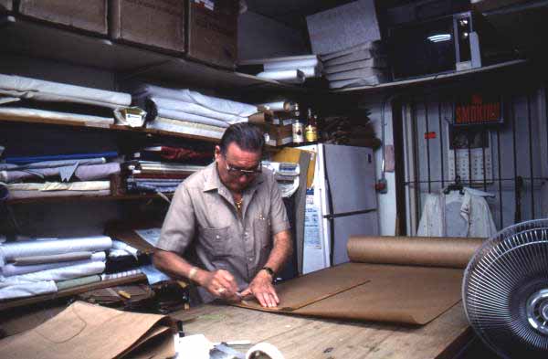 Ramon Puig measuring a pattern to make clothing - Miami, Florida.