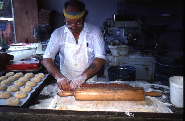 Marty Kaufmann rolling dough to make knishes at Suzanne's Foods - Miami, Florida.