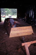 Bobby Shiver building an oyster skiff in his boat shop - Eastpoint, Florida