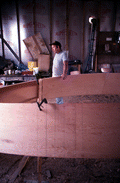 Bobby Shiver with an oyster skiff being built in his boat shop - Eastpoint, Florida