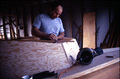Bobby Shiver works on the cabin of an oyster skiff - Eastpoint, Florida
