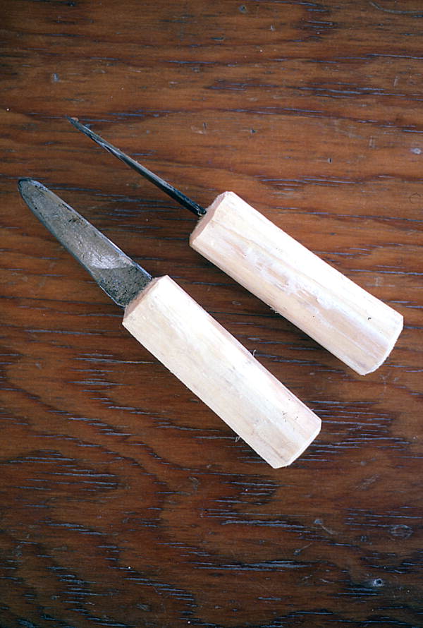 Wooden handle oyster knives made by Loys Cain.