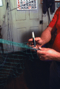 L. Scarabin making a cast net - Apalachicola, Florida