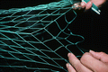 L. Scarabin making a cast net - Apalachicola, Florida