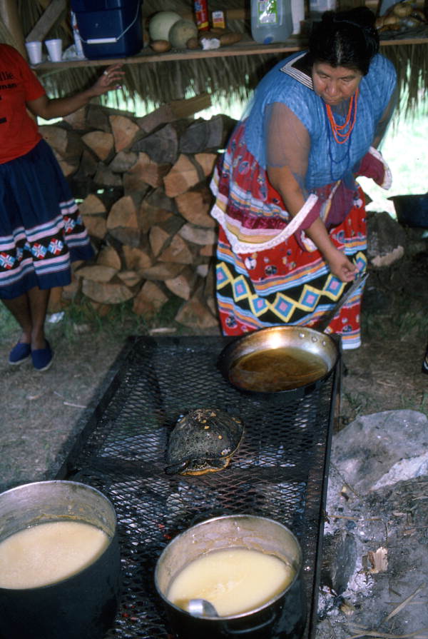 Unidentified Seminole woman cooking food at the 1987 Florida Folk Festival - White Springs, Florida