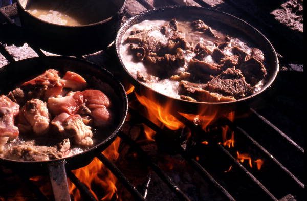 Dinner cooking on open fire at Rosie and Alice Billie's family camp - Ochopee, Florida