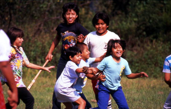 Children playing stick ball - Big Cypress Indian Reservation, Florida