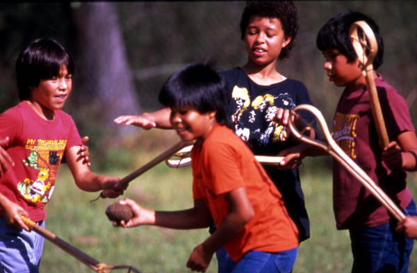 Boys playing stick ball - Big Cypress Indian Reservation, Florida