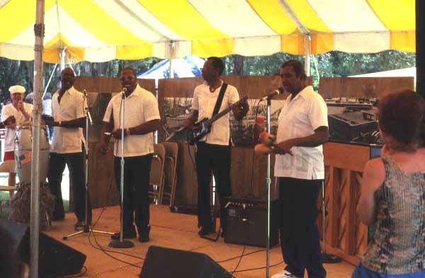 Junkanoos performing Bahamian music : - White Springs, Florida