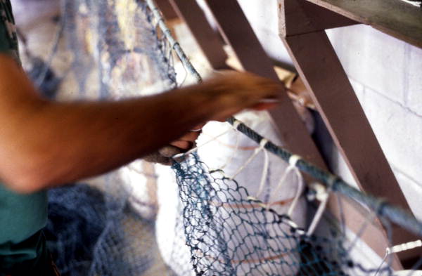 Rickey Doublerly knitting a fishing net - Jacksonville, Florida