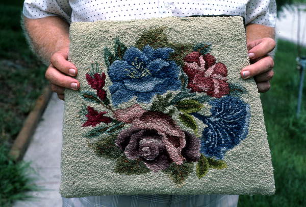 Marjorie Cornelius holding a rug she "hooked" - Apopka, Florida