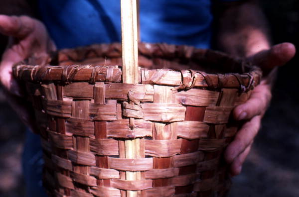 Harlan Baxter holding a basket he made