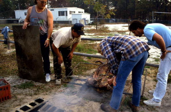 Checking to see if the lechon is done - Jacksonville, Florida