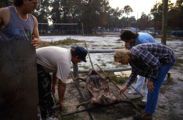 Checking to see if the lechon is done - Jacksonville, Florida