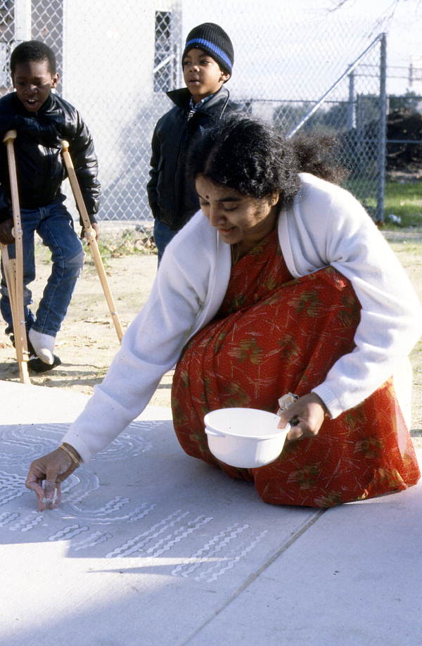 Prema Kumar giving a rice flour painting demonstration to kindergarten students - Jacksonville, Florida.