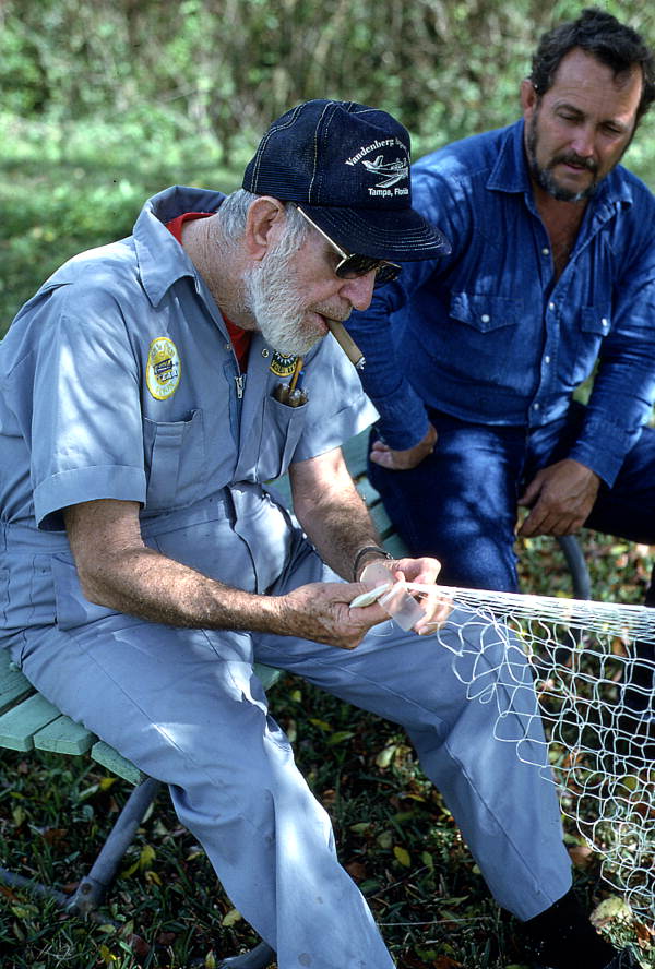 Max Dooley showing apprentice Reginald Reis how to make a cast net - Lakeland, Florida