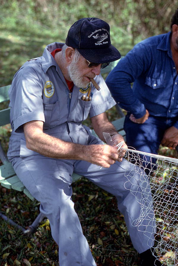 Max Dooley showing apprentice Reginald Reis how to make a cast net - Lakeland, Florida