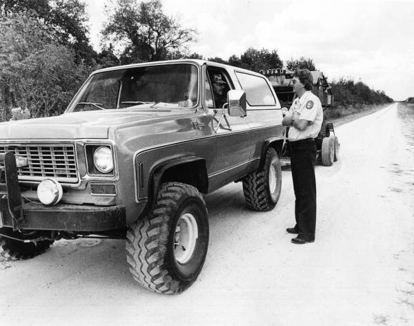 Mark Robson speaks to an unidentified man in a truck - Collier County, Florida