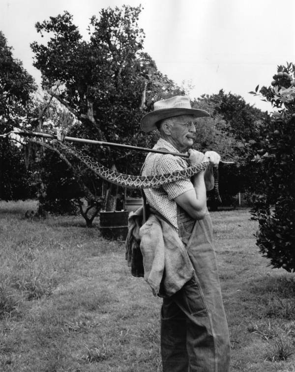 Unidentified man with rattlesnake