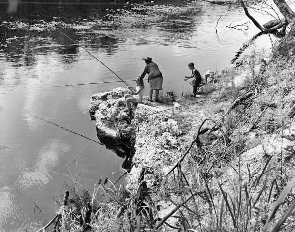 Young boy and girl with woman fishing - Suwannee County, Florida
