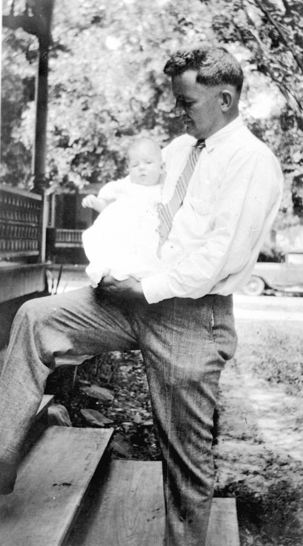 Herbert Drew holding an infant