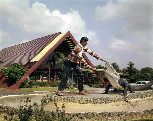 View showing sculpture in front of the Okalee Indian Village and Crafts Center