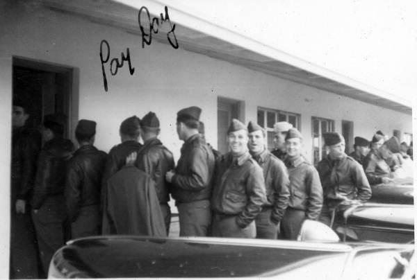 Cadets, at Dorr Field for primary flight training, standing in line for pay day - Arcadia, Florida.