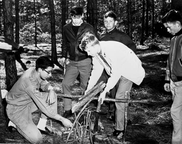Boy Scouts Air Explorers building a fire during summer camp at Tyndall Air Force Base.