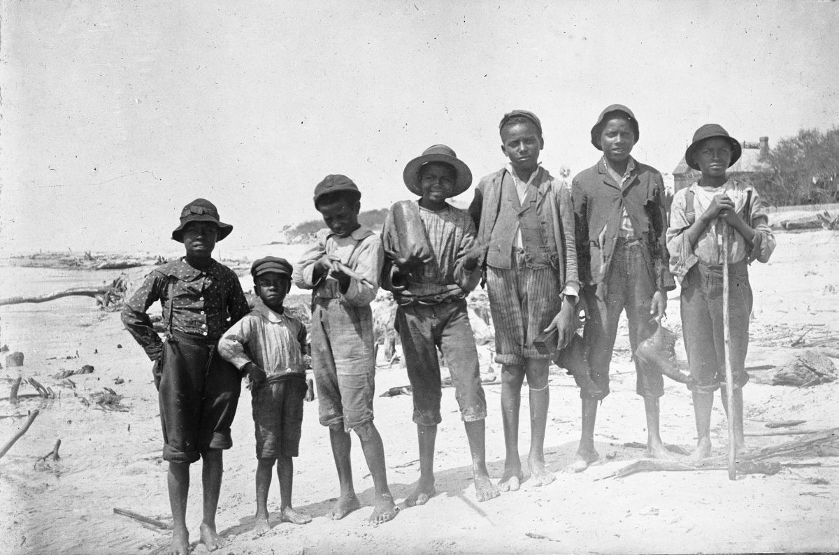 Seven boys on a beach - Apalachicola, Florida.