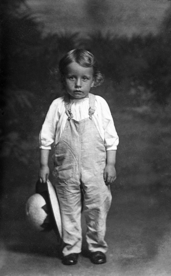 Girl holding her hat